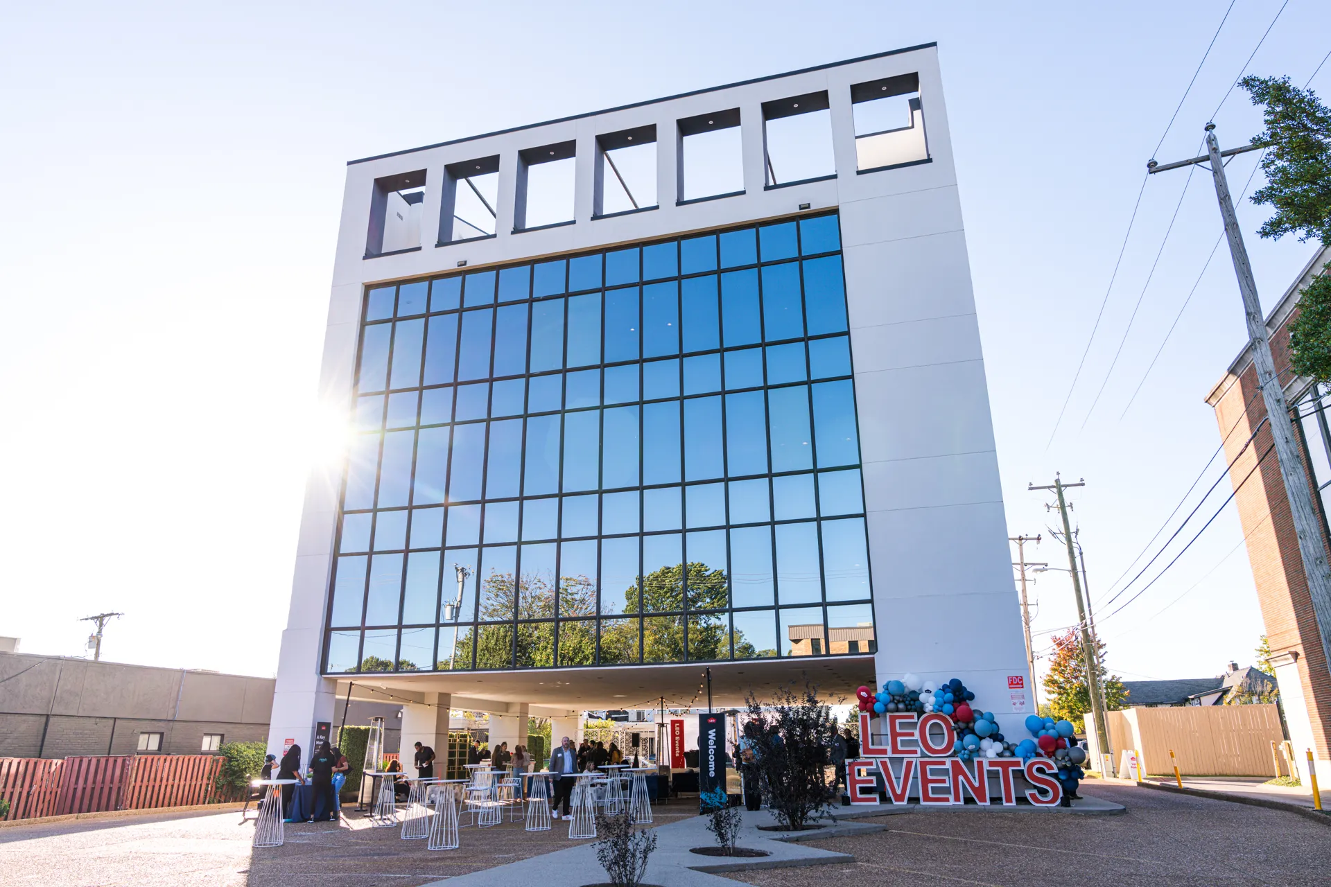 white building with sign and balloons